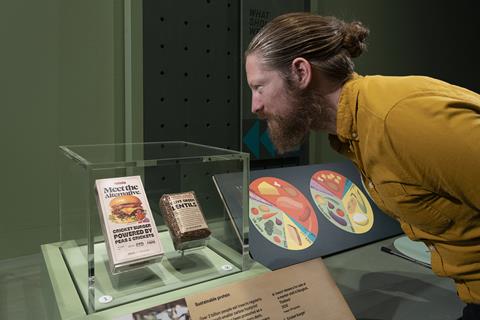 11_Visitor looking at a cricket burger packaging in Future of Food at the Science Museum © Science Museum Group